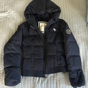 A navy blue puffer jacket